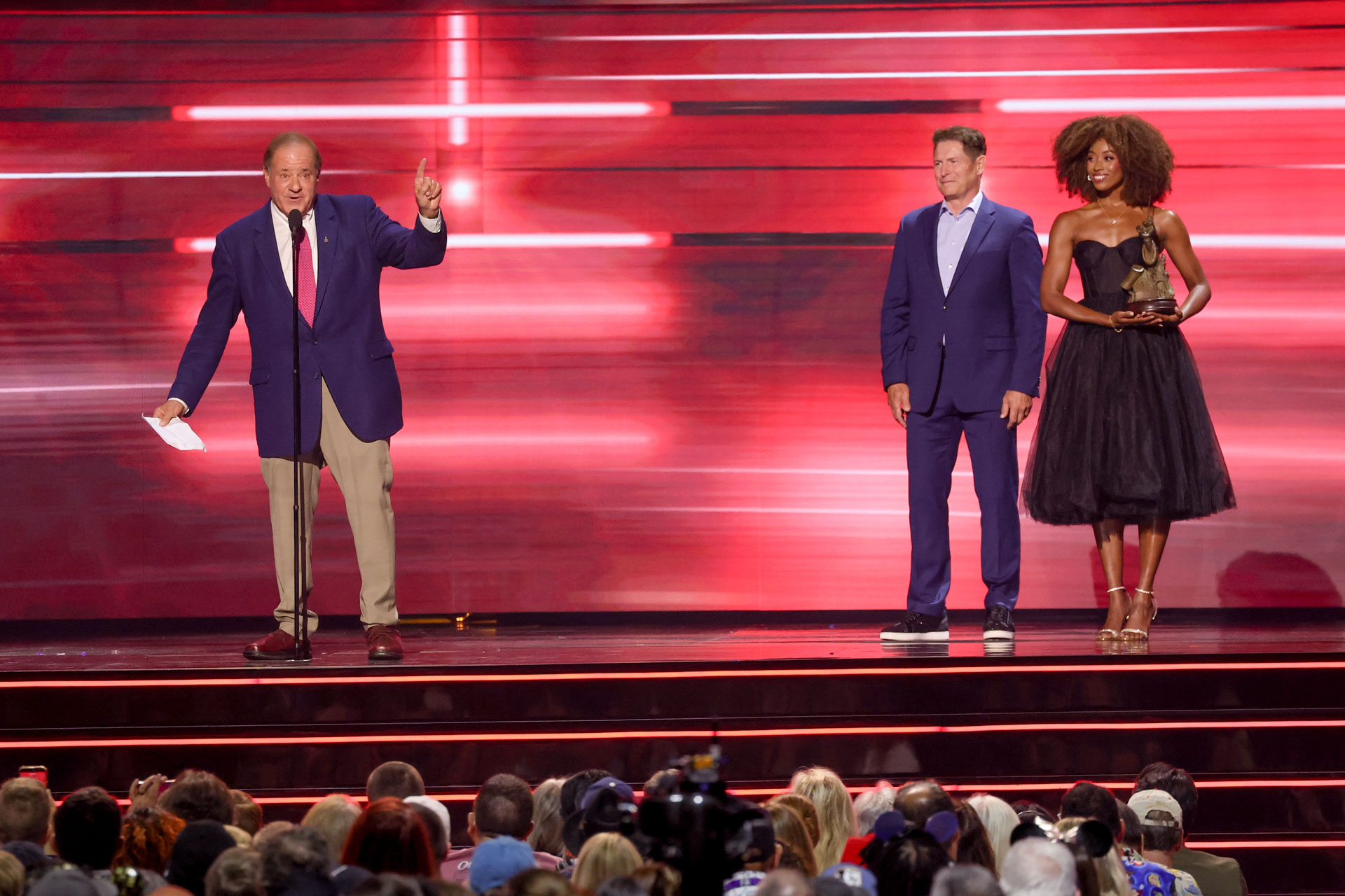Chris Berman speaks onstage alongside Disney Legends honorees during the 2026 Disney Legends Awards ceremony.