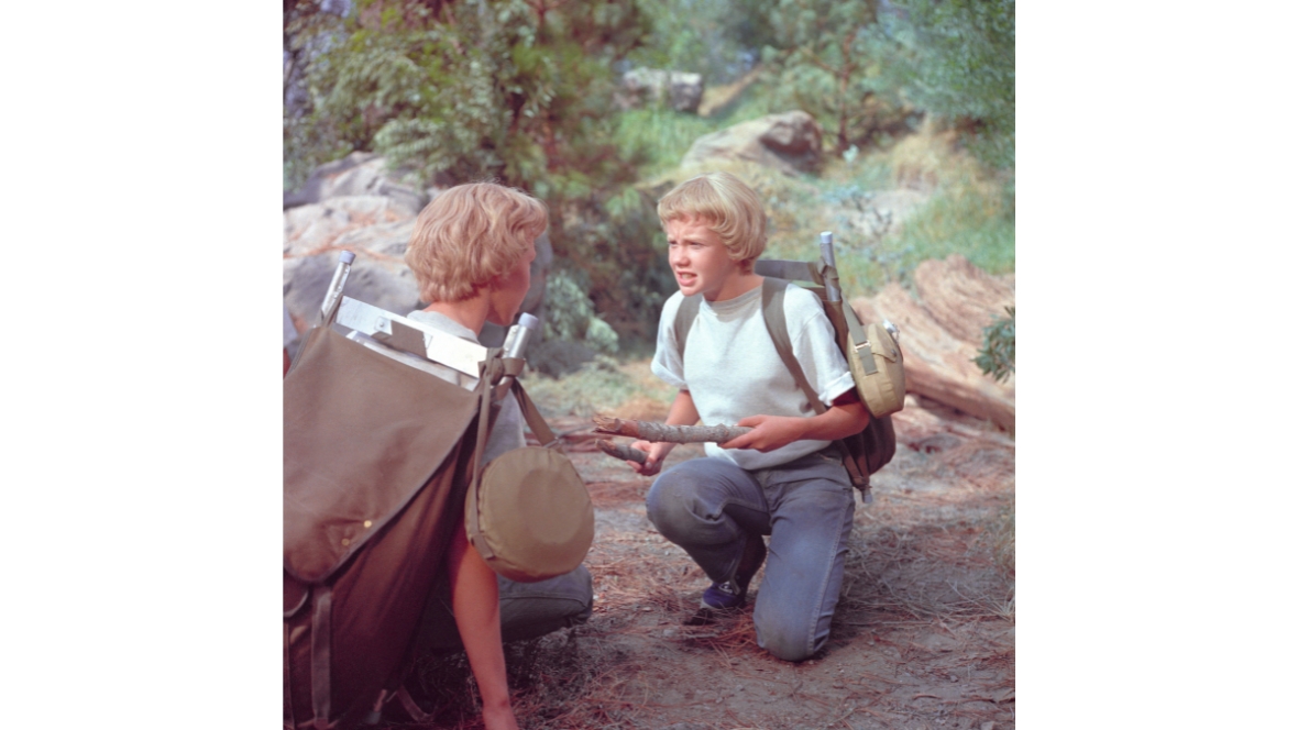 An image from the 1961 Disney film The Parent Trap, with future Disney Legend Hayley Mills portraying (one of the) twins Sharon and Susan; in this image, they are on a camping trip.