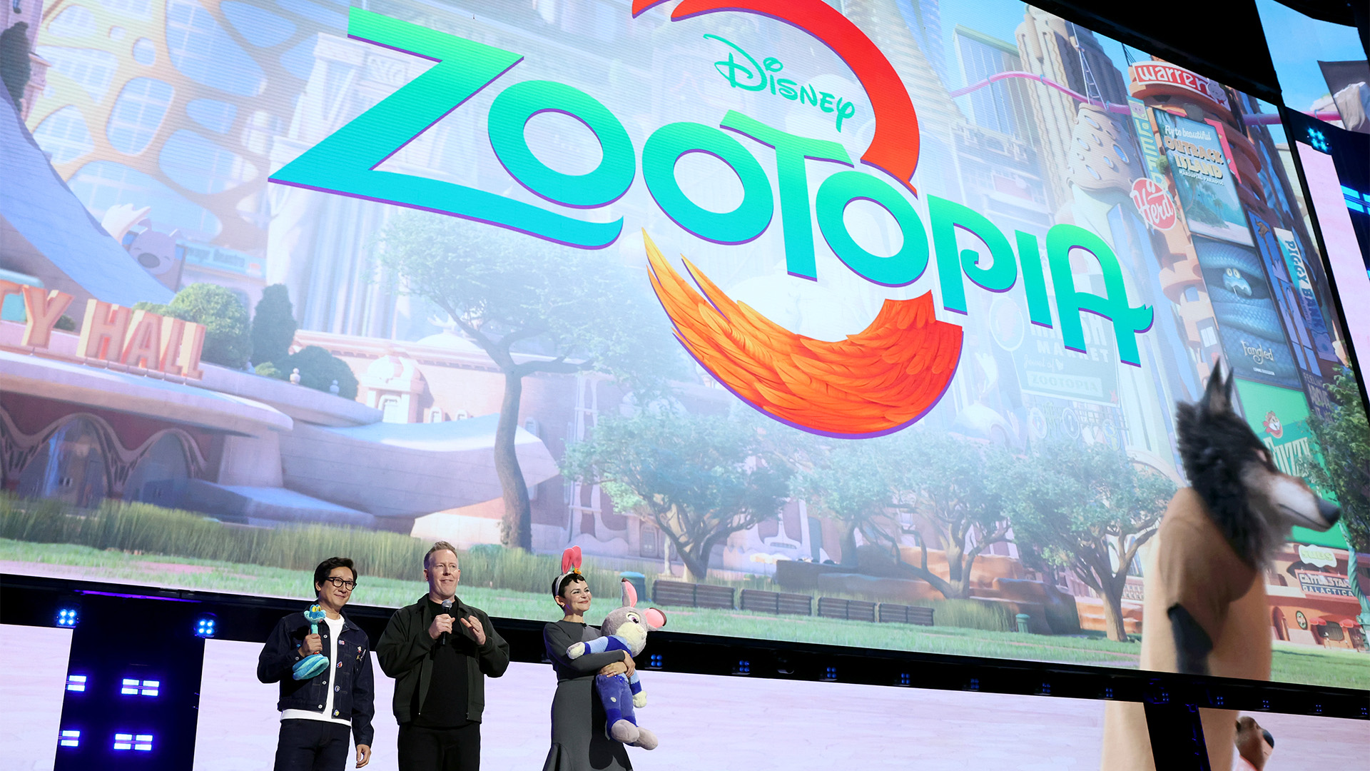 Ke Huy Quan, Jared Bush, and Ginnifer Goodwin appear onstage during the Disney Entertainment Showcase at D23: The Ultimate Disney Fan Event.
