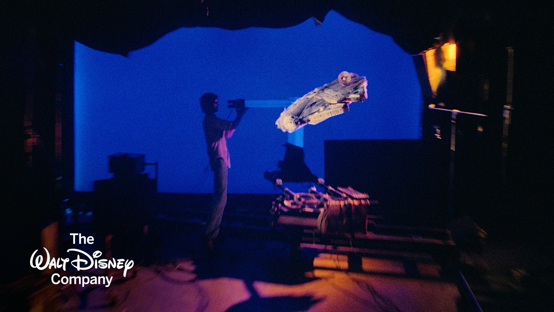 A behind-the-scenes image from Star Wars featuring the Millennium Falcon