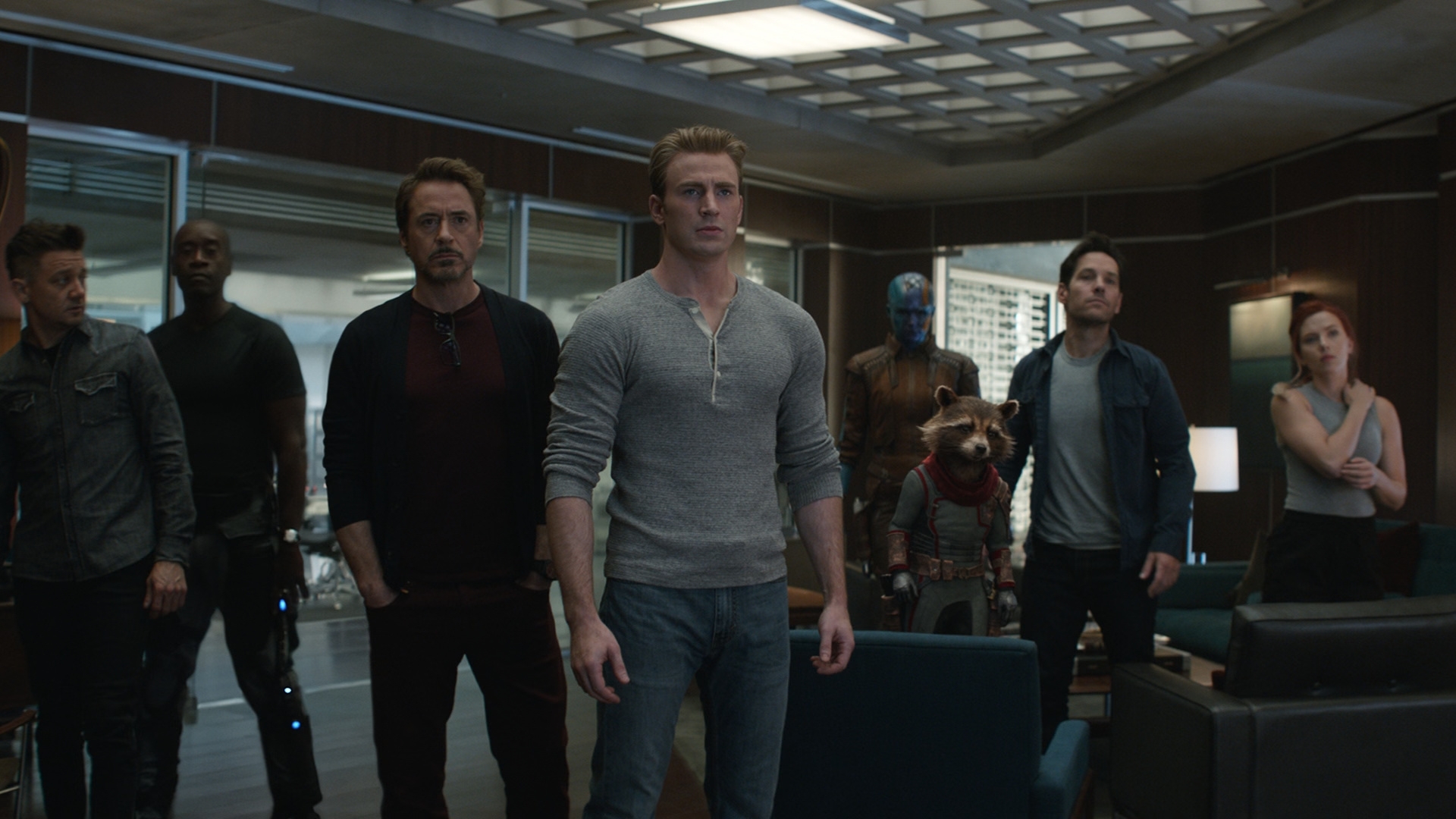 Clint Barton/Hawkeye, played by Jeremy Renner, James “Rhodey” Rhodes/War Machine, played by Don Cheadle, Tony Stark/Iron Man, played by Disney Legend Robert Downey Jr., Steve Rogers/Captain America, played by Chris Evans, Nebula, played by Karen Gillan, Rocket Raccoon, played by Sean Gunn and voiced by Bradley Cooper, Scott Lang/Ant-Man, played by Paul Rudd, and Natasha Romanov/Black Widow, played by Scarlett Johansson, stand in a meeting room in a scene from Avengers Endgame: Encore.