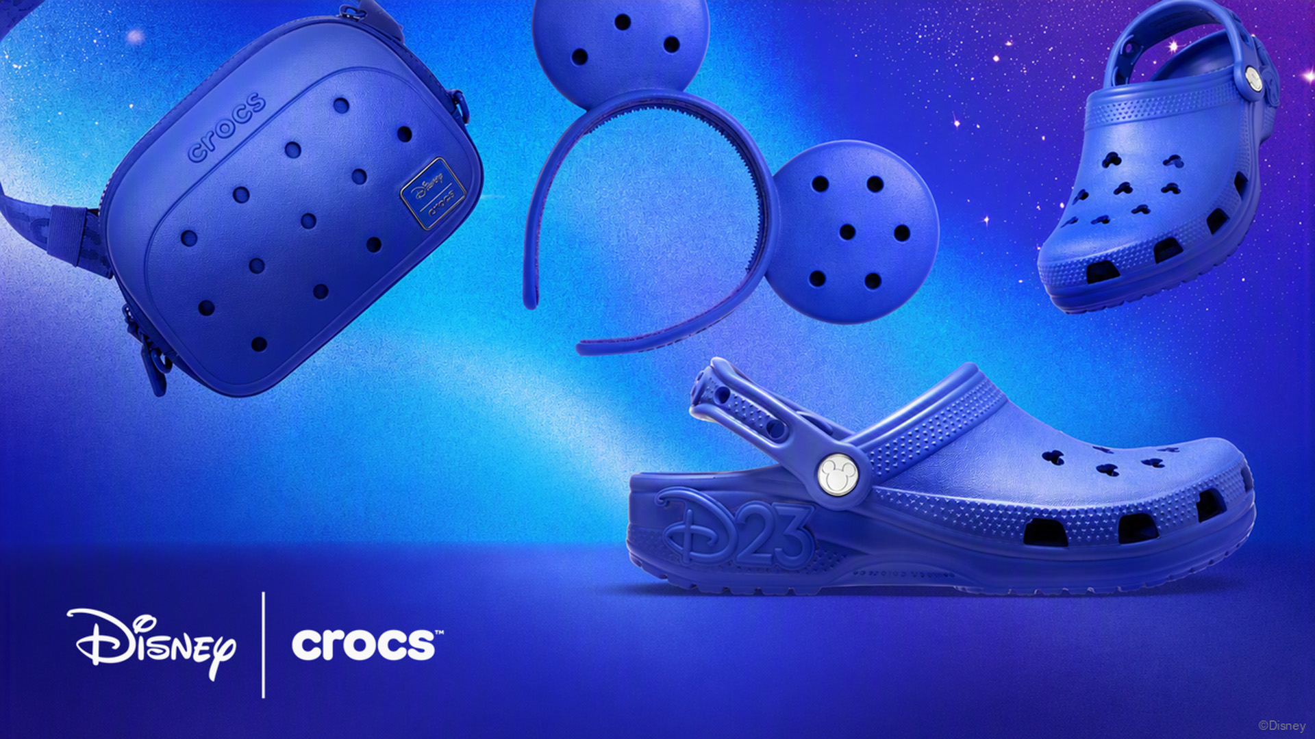 Disney and Crocs D23 collection featuring blue clogs, a backpack, and Mickey Mouse ear headband.