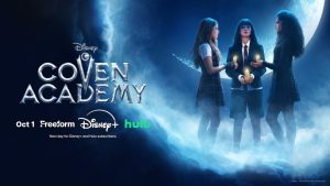 A promotional image for Disney&rsquo;s Coven Academy, featuring Briar (Malina Weissman), Tegan (Ora Duplass), and Sasha (Jordan Leftwich) on the right side of the image; they are standing in a semi-circle and holding candles. The logo for the series is seen on the left, along with logos for Freeform, Disney+, Hulu, and the date of the series&rsquo; premiere.