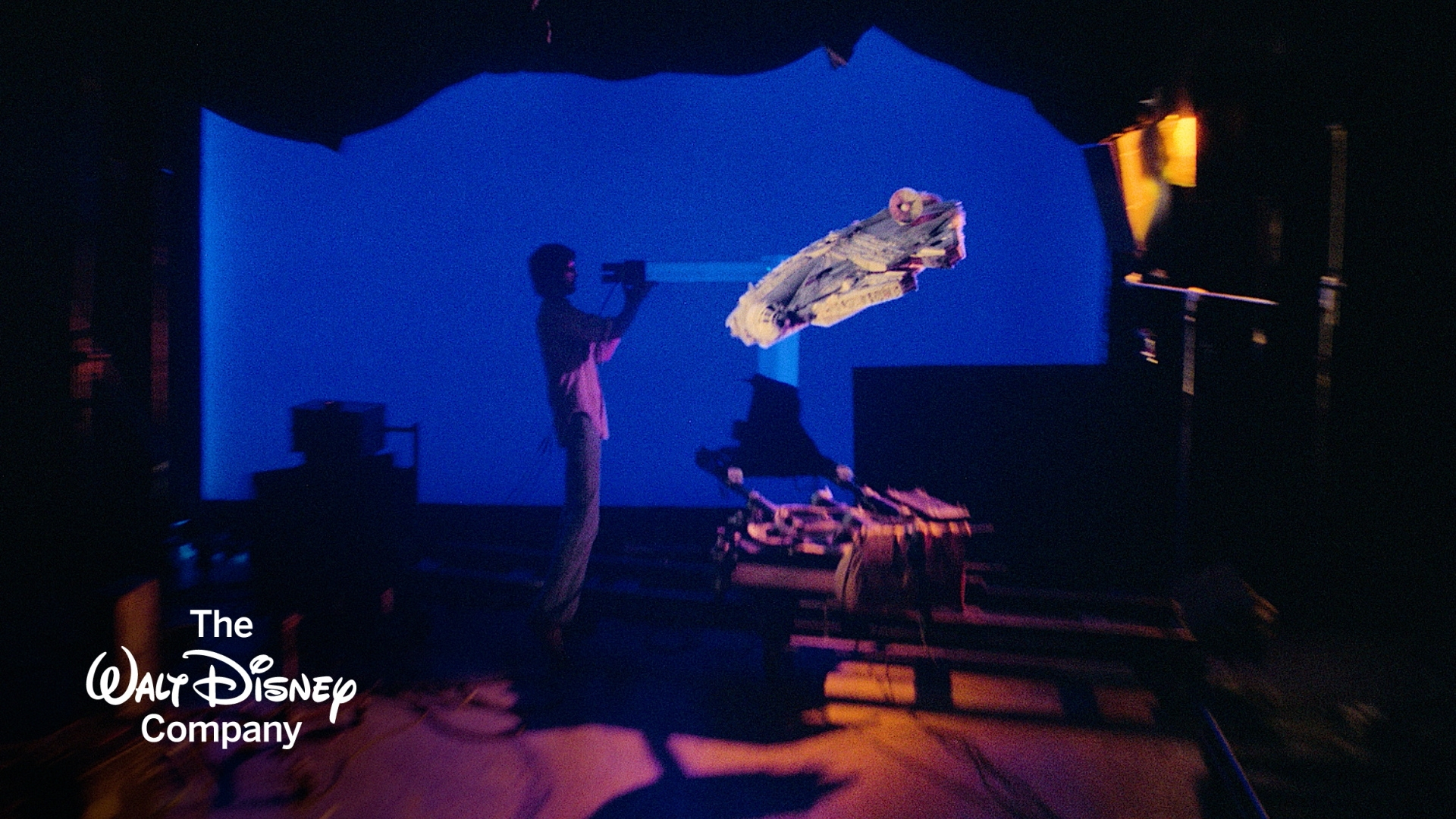 A behind-the-scenes image from Star Wars featuring the Millennium Falcon