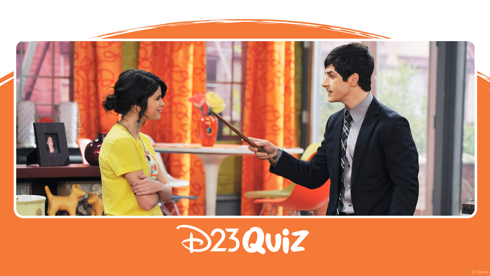 Alex Russo and Justin Russo face each other during a scene from Wizards of Waverly Place, with Justin holding a wand indoors
