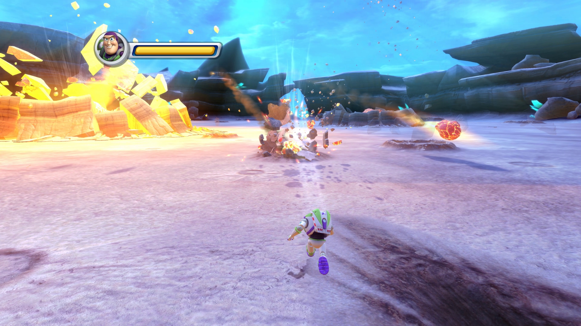 Buzz Lightyear battles enemies amid explosions in a rocky alien landscape in Toy Story 3 Complete Edition.